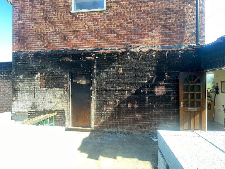 Removing fire damage from brick wall